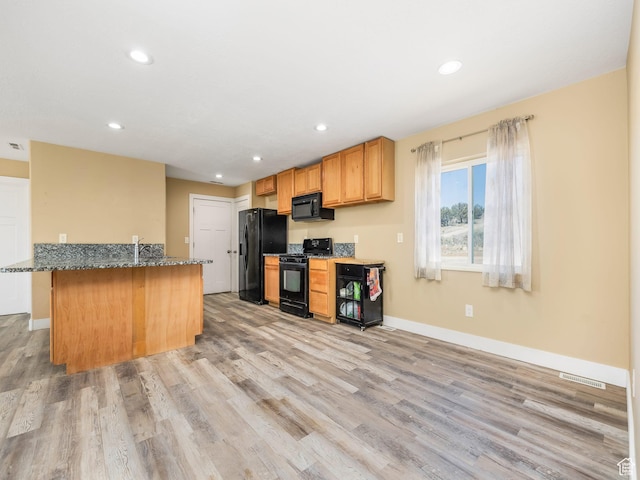 8915 E 33550 N, Fairview, UT 84629 - kitchen featuring baseboards, dark stone countertops, recessed lighting, light wood finished floors, and black appliances