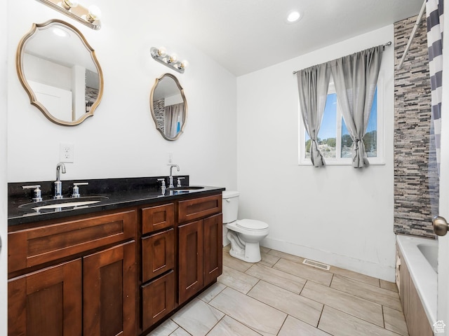 8915 E 33550 N, Fairview, UT 84629 - full bath featuring toilet, double vanity, a sink, and visible vents