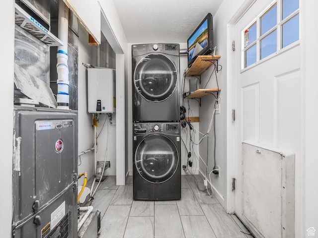 8915 E 33550 N, Fairview, UT 84629 - washroom featuring stacked washer / drying machine, laundry area, tankless water heater, and a textured ceiling
