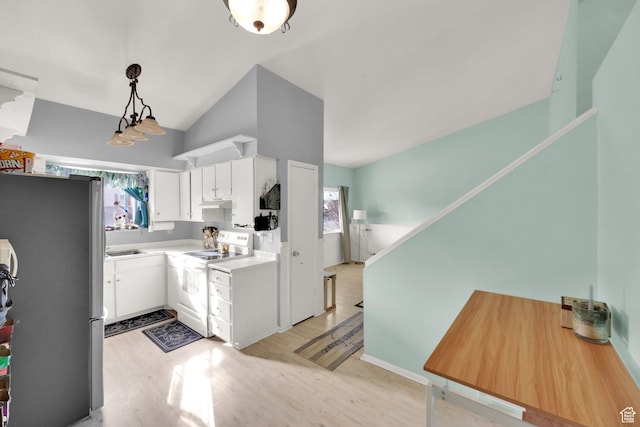 1841 S Nevada Ave, Provo, UT 84606 - kitchen with electric stove, freestanding refrigerator, light wood finished floors, white cabinets, and lofted ceiling