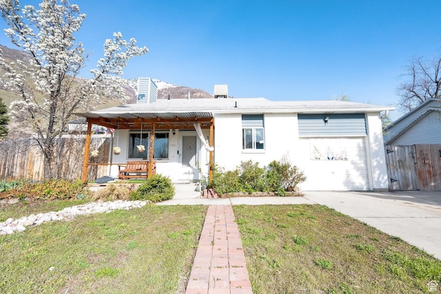 1841 S Nevada Ave, Provo, UT 84606 - view of front of property featuring a porch, driveway, a chimney, and a garage