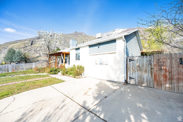 1841 S Nevada Ave, Provo, UT 84606 - view of front facade with a mountain view, a chimney, and a gate