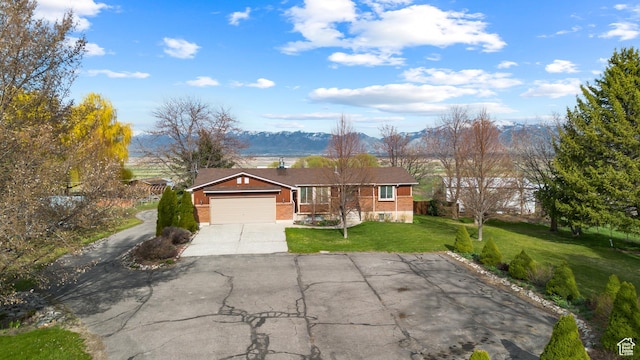 80 S 6000 W, Mendon, UT 84325 - ranch-style home with an attached garage, concrete driveway, a front lawn, and brick siding