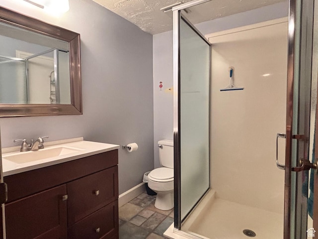 80 S 6000 W, Mendon, UT 84325 - bathroom with toilet, a stall shower, vanity, and baseboards