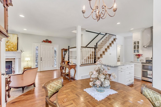 3895 S Grindstone Dr, Springville, UT 84663 - dining space with a notable chandelier, recessed lighting, stairs, visible vents, and a tile fireplace