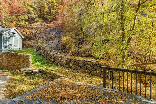 3895 S Grindstone Dr, Springville, UT 84663 - view of yard with an outbuilding, a forest view, and a storage unit