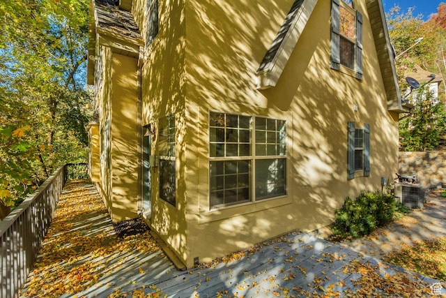 3895 S Grindstone Dr, Springville, UT 84663 - view of side of home with fence, stucco siding, and central AC unit