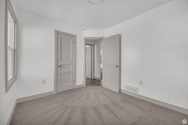 142 Ray St, Ogden, UT 84404 - carpeted spare room with visible vents and baseboards