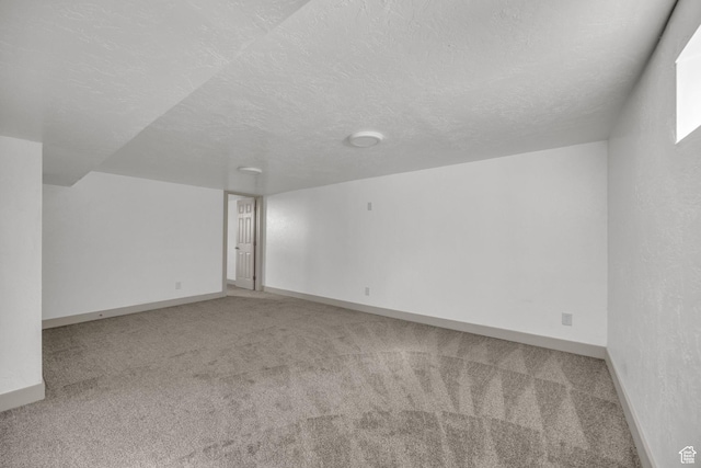 142 Ray St, Ogden, UT 84404 - empty room with baseboards, light colored carpet, and a textured ceiling