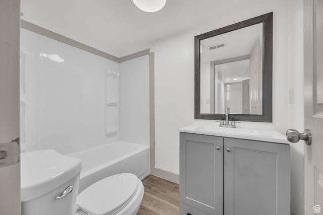 142 Ray St, Ogden, UT 84404 - bathroom featuring vanity, shower / tub combination, toilet, visible vents, and wood finished floors