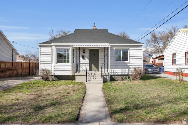 142 Ray St, Ogden, UT 84404 - bungalow featuring a front lawn, fence, and a shingled roof