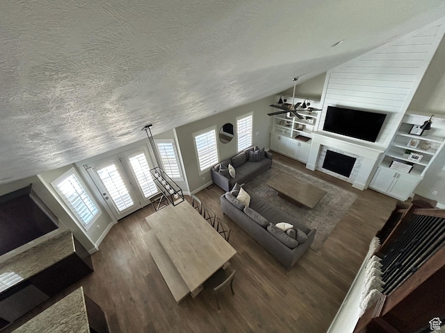 10124 S Autumn Breeze Ln W, South Jordan, UT 84009 - living area featuring ceiling fan, a fireplace, a textured ceiling, wood finished floors, and lofted ceiling