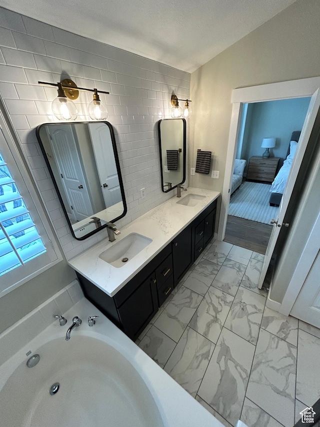 10124 S Autumn Breeze Ln W, South Jordan, UT 84009 - ensuite bathroom featuring double vanity, ensuite bathroom, marble finish floor, and a sink