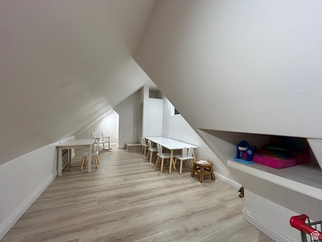 10124 S Autumn Breeze Ln W, South Jordan, UT 84009 - additional living space featuring wood finished floors, baseboards, and lofted ceiling
