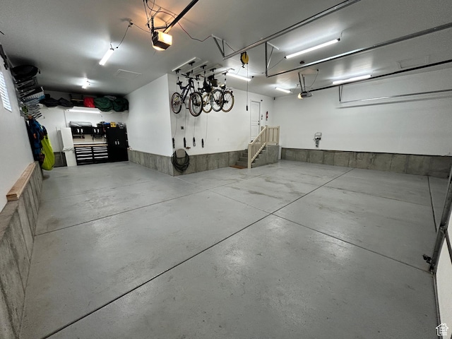 10124 S Autumn Breeze Ln W, South Jordan, UT 84009 - garage with a workshop area and a garage door opener