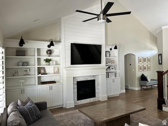 10124 S Autumn Breeze Ln W, South Jordan, UT 84009 - living room with a ceiling fan, a premium fireplace, high vaulted ceiling, arched walkways, and wood finished floors