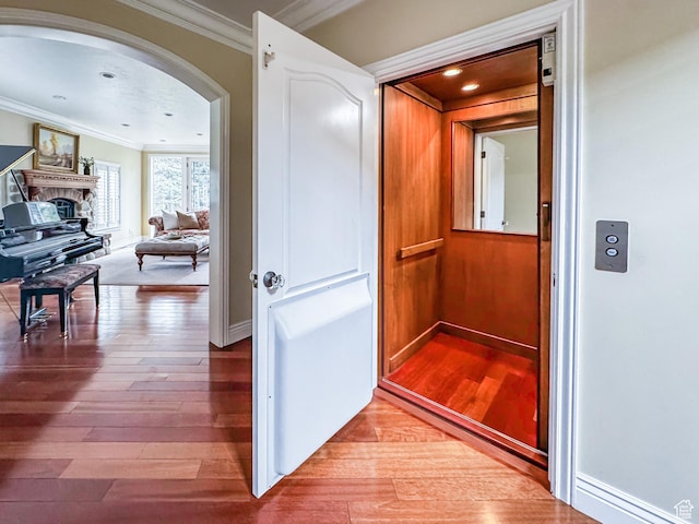 6041 S 2230 E, Holladay, UT 84121 - corridor with arched walkways, crown molding, elevator, and wood finished floors