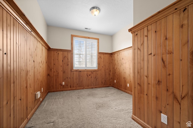 6041 S 2230 E, Holladay, UT 84121 - empty room featuring wainscoting, visible vents, carpet floors, and wood walls