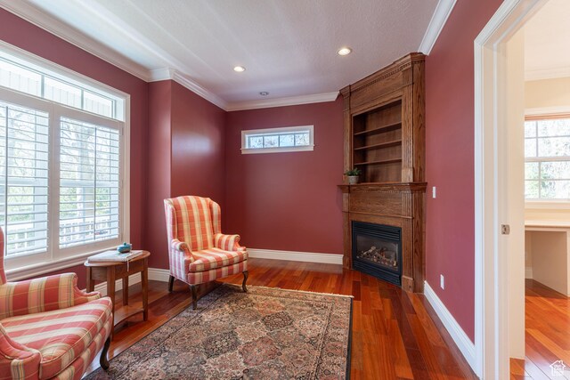 6041 S 2230 E, Holladay, UT 84121 - living area featuring a wealth of natural light, wood finished floors, a fireplace, and crown molding