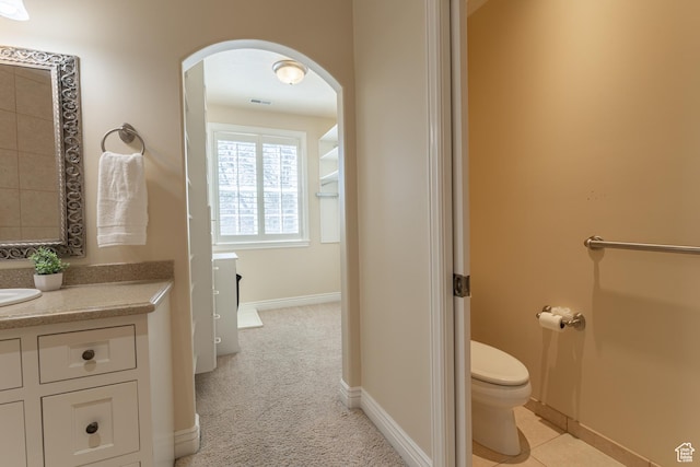 6041 S 2230 E, Holladay, UT 84121 - bathroom featuring toilet, vanity, visible vents, and baseboards