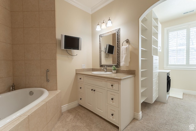 6041 S 2230 E, Holladay, UT 84121 - full bath with visible vents, vanity, a relaxing tiled tub, crown molding, and baseboards