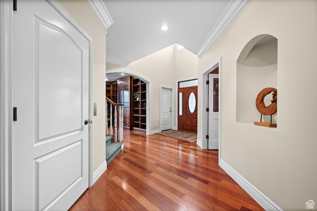 6041 S 2230 E, Holladay, UT 84121 - hallway featuring arched walkways, baseboards, and ornamental molding