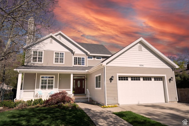 view of front facade with concrete driveway, a porch, and a garage