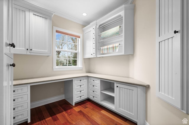 6041 S 2230 E, Holladay, UT 84121 - unfurnished office with built in desk, recessed lighting, ornamental molding, baseboards, and dark wood-style flooring