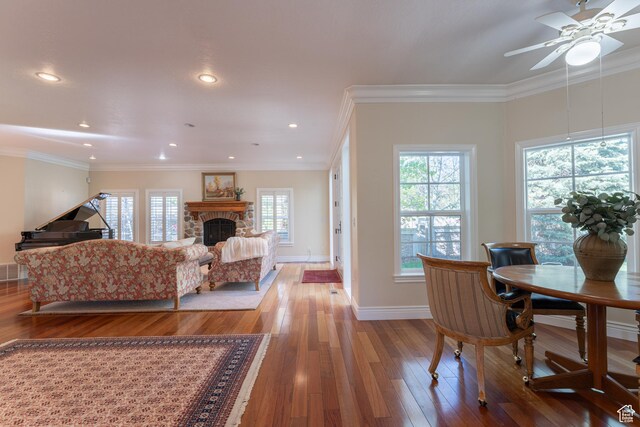 6041 S 2230 E, Holladay, UT 84121 - living area featuring wood finished floors, a stone fireplace, baseboards, and ceiling fan