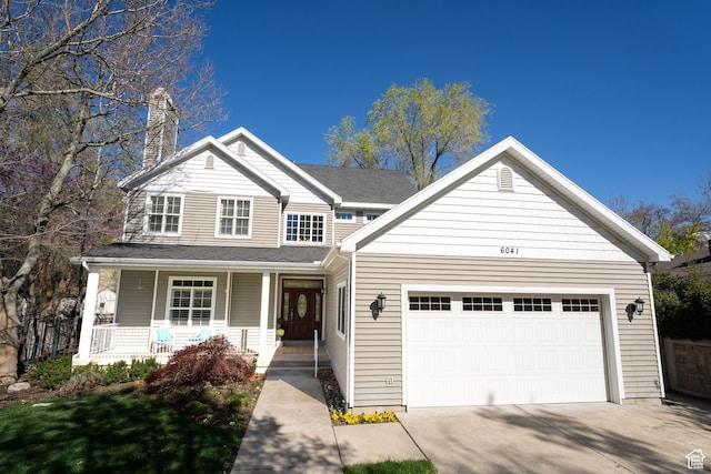 6041 S 2230 E, Holladay, UT 84121 - view of front of property with an attached garage, driveway, covered porch, and a chimney