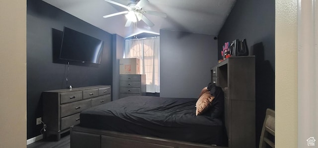 bedroom featuring ceiling fan, baseboards, and lofted ceiling