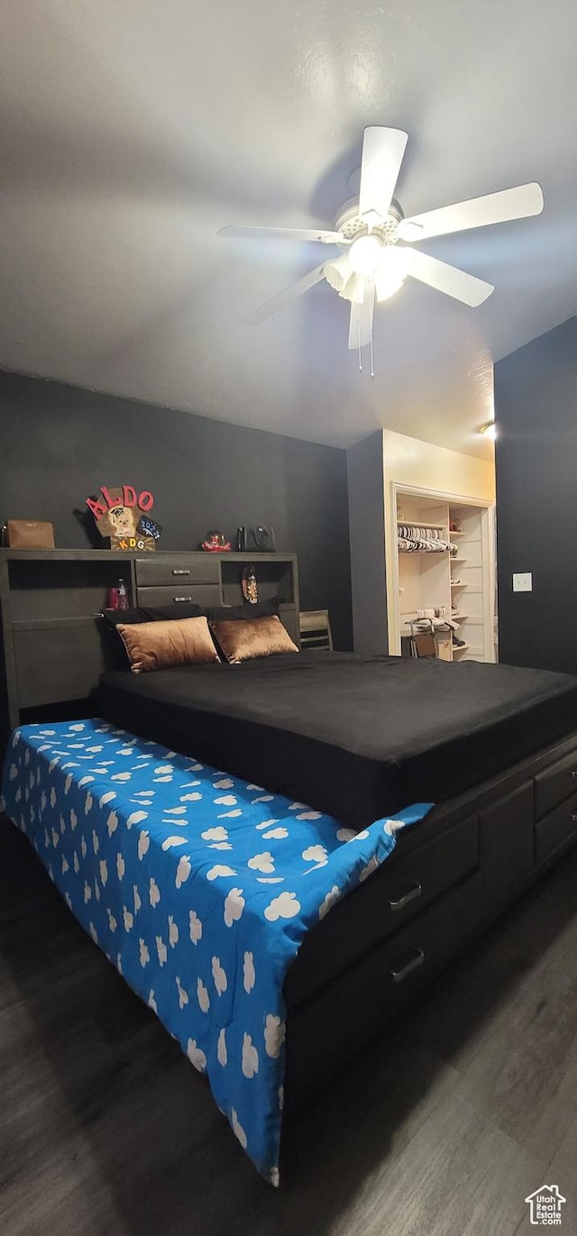 bedroom featuring ceiling fan and wood finished floors