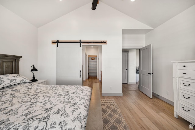 48 S 650 W, Hyrum, UT 84319 - bedroom with a barn door, light wood-type flooring, high vaulted ceiling, baseboards, and recessed lighting
