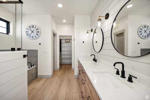 48 S 650 W, Hyrum, UT 84319 - full bath with wood finished floors, double vanity, a garden tub, a spacious closet, and baseboards