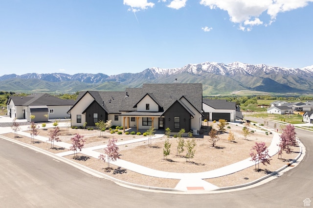 48 S 650 W, Hyrum, UT 84319 - view of front of house with a mountain view, board and batten siding, and roof with shingles