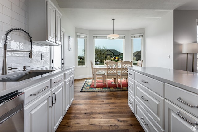 4781 W 4100 S, West Haven, UT 84401 - kitchen with a sink, dark wood-style flooring, decorative backsplash, and white cabinets
