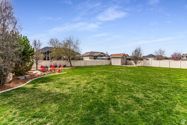 4781 W 4100 S, West Haven, UT 84401 - view of yard featuring a storage unit, a residential view, and an outbuilding