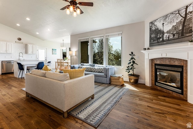 4781 W 4100 S, West Haven, UT 84401 - living area with lofted ceiling, dark wood-style floors, ceiling fan, recessed lighting, and a tile fireplace