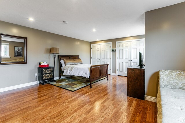 4781 W 4100 S, West Haven, UT 84401 - bedroom with light wood finished floors, baseboards, multiple closets, and recessed lighting