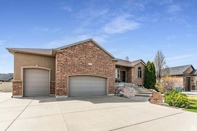 4781 W 4100 S, West Haven, UT 84401 - view of front of property featuring an attached garage, driveway, and brick siding
