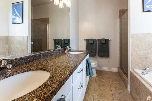 4781 W 4100 S, West Haven, UT 84401 - full bathroom featuring a shower stall, tile patterned floors, toilet, a garden tub, and double vanity