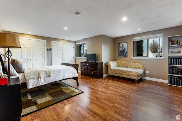 4781 W 4100 S, West Haven, UT 84401 - bedroom with baseboards, wood finished floors, multiple closets, and recessed lighting