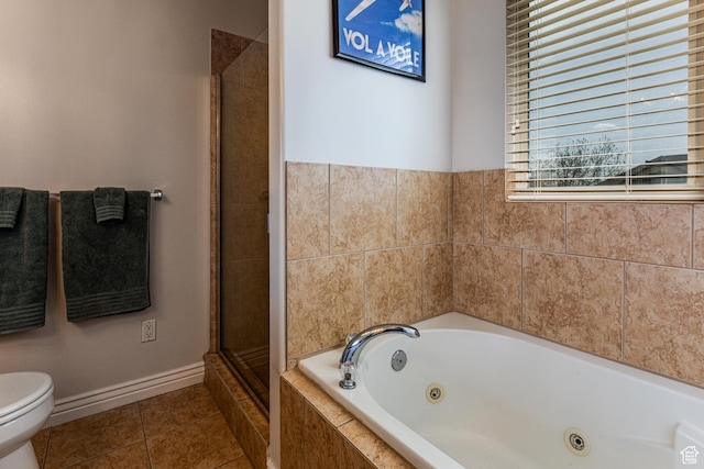 4781 W 4100 S, West Haven, UT 84401 - bathroom featuring toilet, tile patterned floors, a jetted tub, a stall shower, and baseboards