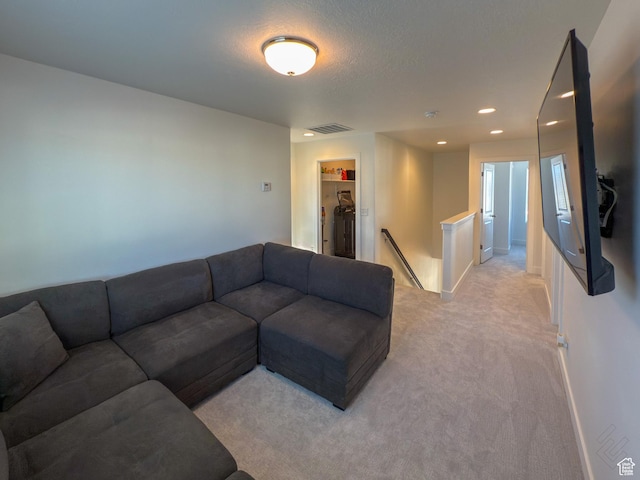 5051 W Bilston Ln S, Herriman, UT 84096 - living room featuring visible vents, baseboards, a textured ceiling, recessed lighting, and light colored carpet