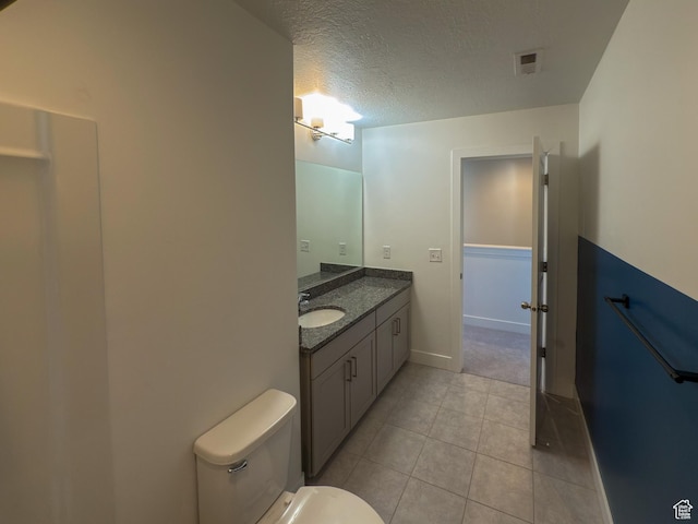5051 W Bilston Ln S, Herriman, UT 84096 - bathroom with visible vents, toilet, a textured ceiling, vanity, and tile patterned flooring