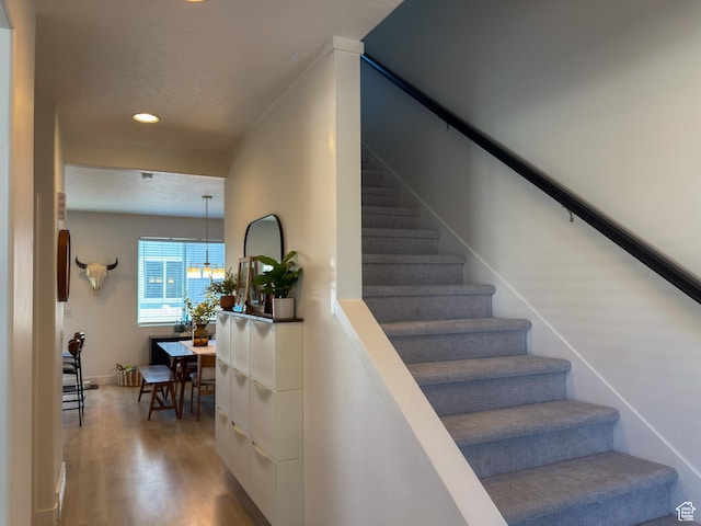 5051 W Bilston Ln S, Herriman, UT 84096 - stairway with a textured ceiling, wood finished floors, and recessed lighting