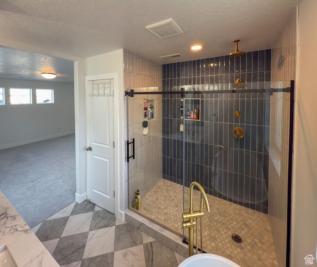 5051 W Bilston Ln S, Herriman, UT 84096 - full bathroom featuring a stall shower, baseboards, visible vents, and a textured ceiling