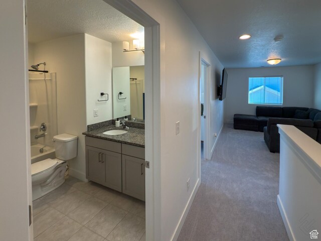 5051 W Bilston Ln S, Herriman, UT 84096 - bathroom with vanity, a textured ceiling, baseboards, and toilet