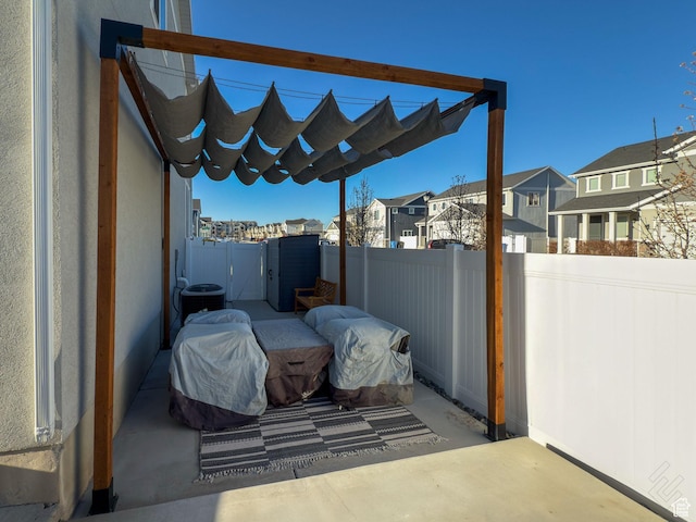 5051 W Bilston Ln S, Herriman, UT 84096 - view of patio with a residential view, central AC, and fence