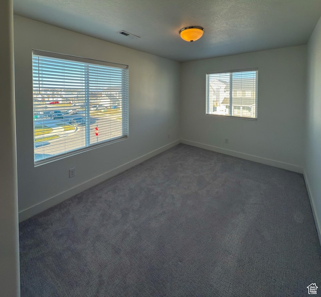 5051 W Bilston Ln S, Herriman, UT 84096 - unfurnished room featuring visible vents, baseboards, carpet floors, and a textured ceiling